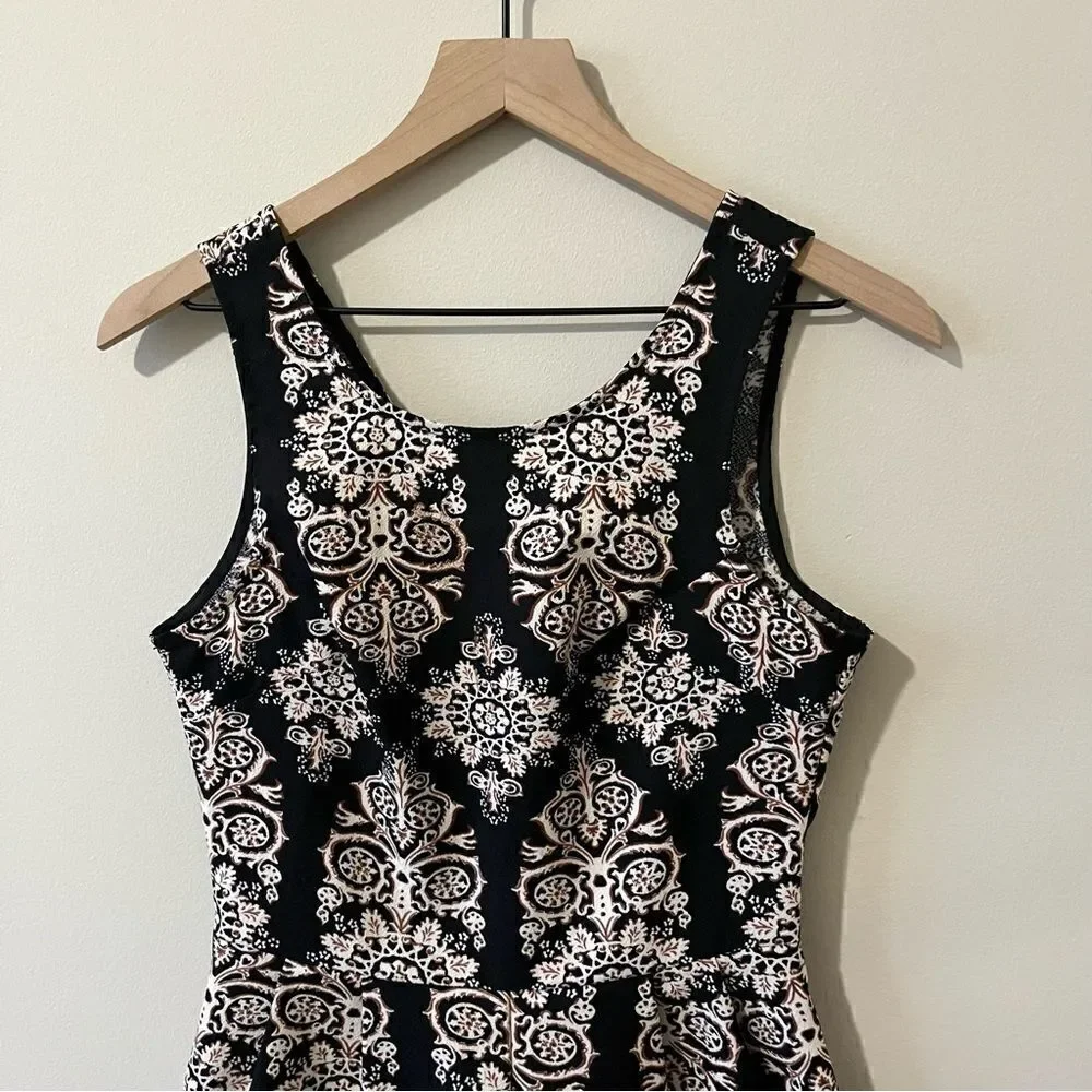 Lush  romper one piece Size small fun all over print sleeveless date